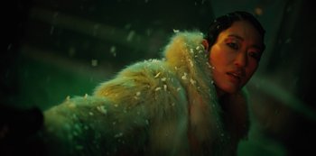 Movie still from “Altered Carbon” (2018), created by Laeta Kalogridis – A woman wearing a fur coat in the rain; Close Up shot, Low angle