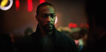 Movie still from “Altered Carbon” (2018), created by Laeta Kalogridis – A person wearing a black jacket; Close Up shot, Low angle