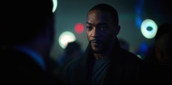 Movie still from “Altered Carbon” (2018), created by Laeta Kalogridis – A person wearing a jacket; Close Up shot, Over the shoulder angle
