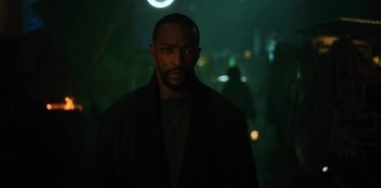 Movie still from “Altered Carbon” (2018), created by Laeta Kalogridis – A man standing in the dark in the dark; Close Up shot, Low angle
