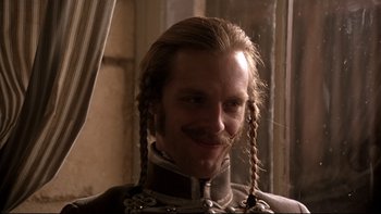 Movie still from “The Duellists” (1977), directed by Ridley Scott – A person with long hair; Close Up shot, Low angle