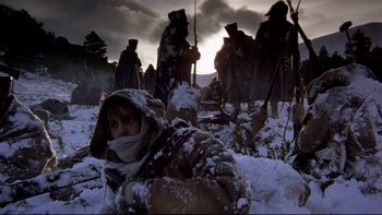 Movie still from “The Duellists” (1977), directed by Ridley Scott – A group of people standing in the snow; Wide shot, Low angle