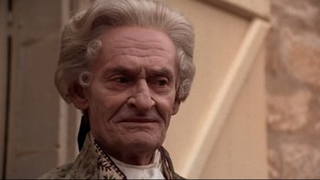 Movie still from “The Duellists” (1977), directed by Ridley Scott – An old man with white hair and a mustache; Close Up shot, Low angle