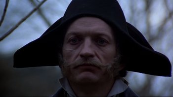 Movie still from “The Duellists” (1977), directed by Ridley Scott – A person wearing a hat; Close Up shot, Low angle