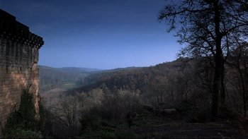 Movie still from “The Duellists” (1977), directed by Ridley Scott – A view of a valley with trees in the foreground; Extreme Wide shot, High angle