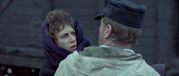 Movie still from “The Eagle Has Landed” (1976), directed by John Sturges – A man and a woman looking at one another; Close Up shot, Over the shoulder angle