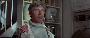 Movie still from “The Eagle Has Landed” (1976), directed by John Sturges – A person wearing a sweater; Close Up shot, Low angle