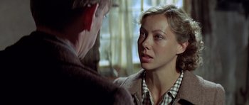 Movie still from “The Eagle Has Landed” (1976), directed by John Sturges – A man and a woman looking at one another; Close Up shot, Over the shoulder angle