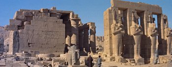Movie still from “The Egyptian” (1954), directed by Michael Curtiz – Two men are standing in the middle of an ancient city; Extreme Wide shot, Low angle