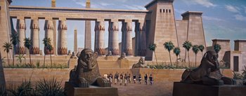Movie still from “The Egyptian” (1954), directed by Michael Curtiz – A group of people standing in front of a building; Extreme Wide shot, High angle