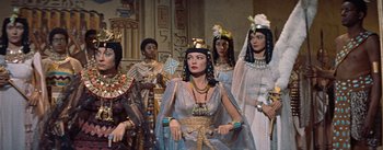 Movie still from “The Egyptian” (1954), directed by Michael Curtiz – A group of women dressed in ancient egyptian clothing; Medium shot, Low angle