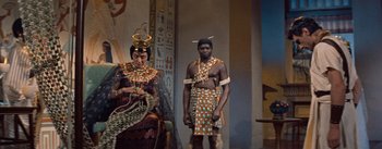 Movie still from “The Egyptian” (1954), directed by Michael Curtiz – A man and a woman dressed in ancient egyptian clothing; Medium shot, Over the shoulder angle