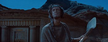 Movie still from “The Egyptian” (1954), directed by Michael Curtiz – An old man with a long hair and a long beard; Medium shot, Low angle