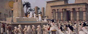 Movie still from “The Egyptian” (1954), directed by Michael Curtiz – A group of people dressed in ancient egyptian clothing; Extreme Wide shot, High angle