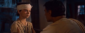 Movie still from “The Egyptian” (1954), directed by Michael Curtiz – A man and a woman looking at one another; Close Up shot, Over the shoulder angle