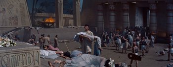 Movie still from “The Egyptian” (1954), directed by Michael Curtiz – A group of people are gathered in a field; Extreme Wide shot, High angle