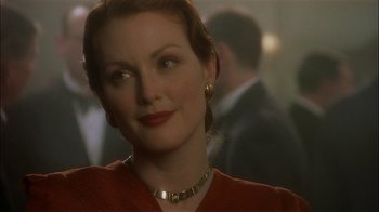 Movie still from “The End of the Affair” (1999), directed by Neil Jordan – A person wearing a necklace; Close Up shot, Over the shoulder angle