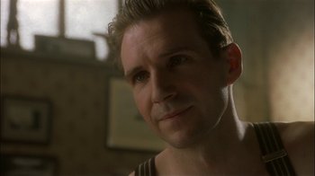 Movie still from “The End of the Affair” (1999), directed by Neil Jordan – A person wearing a shirt; Close Up shot, Low angle