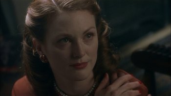 Movie still from “The End of the Affair” (1999), directed by Neil Jordan – A person wearing a necklace; Close Up shot, Over the shoulder angle