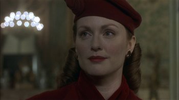 Movie still from “The End of the Affair” (1999), directed by Neil Jordan – A person wearing a hat; Close Up shot, Over the shoulder angle