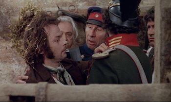 Movie still from “The Enigma of Kaspar Hauser” (1974), directed by Werner Herzog – A group of men standing next to each other; Close Up shot, Over the shoulder angle