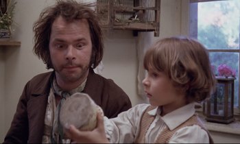 Movie still from “The Enigma of Kaspar Hauser” (1974), directed by Werner Herzog – A man and a boy are looking at a rock; Close Up shot, Over the shoulder angle