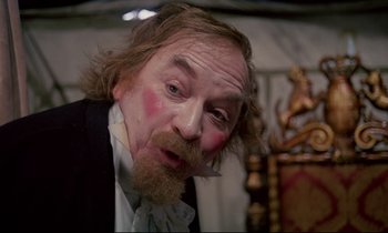 Movie still from “The Enigma of Kaspar Hauser” (1974), directed by Werner Herzog – A person with a beard and mustache; Close Up shot, Over the shoulder angle