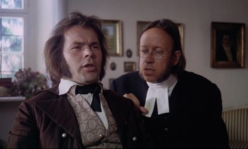 Movie still from “The Enigma of Kaspar Hauser” (1974), directed by Werner Herzog – Two men dressed up in suits and wigs; Medium shot, Over the shoulder angle
