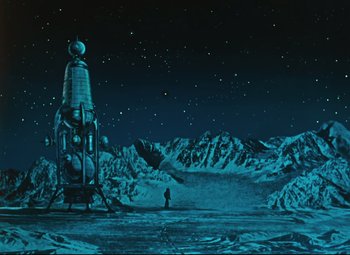 Movie still from “The Fabulous Baron Munchausen” (1962), directed by Karel Zeman – An image of a man standing in front of a space station; Extreme Wide shot, Low angle