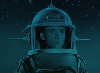 Movie still from “The Fabulous Baron Munchausen” (1962), directed by Karel Zeman – A man wearing a space suit and a helmet; Medium shot, Low angle