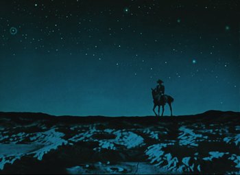 Movie still from “The Fabulous Baron Munchausen” (1962), directed by Karel Zeman – A man riding a horse on top of a hill at night; Extreme Wide shot, Low angle