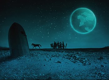 Movie still from “The Fabulous Baron Munchausen” (1962), directed by Karel Zeman – A group of people standing around a horse in a field; Extreme Wide shot, Low angle