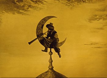 Movie still from “The Fabulous Baron Munchausen” (1962), directed by Karel Zeman – A man sitting on top of a crescent moon; Wide shot, Low angle