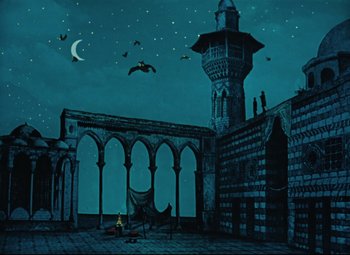 Movie still from “The Fabulous Baron Munchausen” (1962), directed by Karel Zeman – An illustration of a castle with bats flying in the night sky; Extreme Wide shot, Low angle