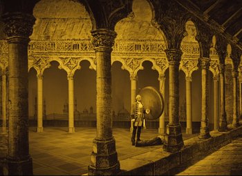 Movie still from “The Fabulous Baron Munchausen” (1962), directed by Karel Zeman – A man standing in a room with a large object in front of him; Extreme Wide shot, High angle