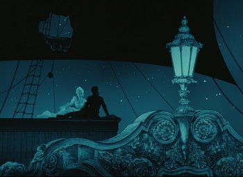 Movie still from “The Fabulous Baron Munchausen” (1962), directed by Karel Zeman – A man and a woman sitting on top of a building; Wide shot, Low angle