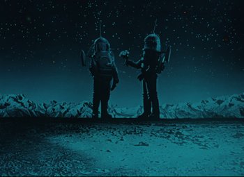 Movie still from “The Fabulous Baron Munchausen” (1962), directed by Karel Zeman – A couple of people standing next to each other on top of a hill; Wide shot, Low angle