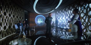 Movie still from “Altered Carbon” (2018), created by Laeta Kalogridis – A man standing in front of a mirror in a room; Wide shot, Over the shoulder angle
