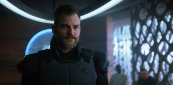 Movie still from “Altered Carbon” (2018), created by Laeta Kalogridis – A person wearing a suit; Close Up shot, Over the shoulder angle