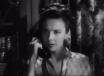 Movie still from “The File on Thelma Jordon” (1949), directed by Robert Siodmak – A woman holding a phone up to her ear; Close Up shot, High angle