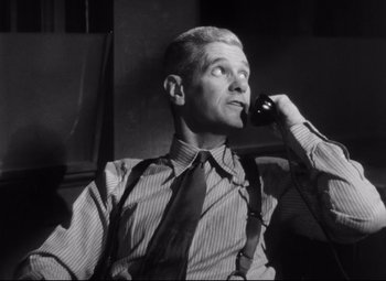 Movie still from “The File on Thelma Jordon” (1949), directed by Robert Siodmak – An old photo of a man talking on a phone; Close Up shot, Low angle