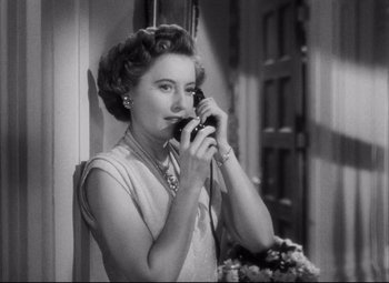 Movie still from “The File on Thelma Jordon” (1949), directed by Robert Siodmak – An old photo of a woman talking on a phone; Close Up shot, High angle