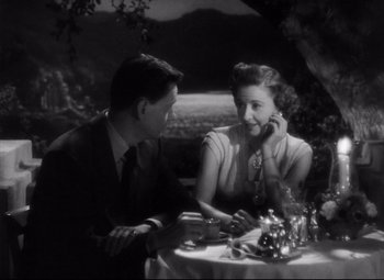 Movie still from “The File on Thelma Jordon” (1949), directed by Robert Siodmak – A man and a woman sitting at a dinner table; Medium shot, High angle
