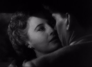 Movie still from “The File on Thelma Jordon” (1949), directed by Robert Siodmak – A man and a woman embracing each other in the dark; Close Up shot, High angle