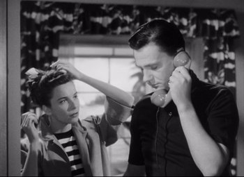 Movie still from “The File on Thelma Jordon” (1949), directed by Robert Siodmak – A man and a woman are talking on the phone; Medium shot, Low angle