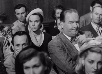 Movie still from “The File on Thelma Jordon” (1949), directed by Robert Siodmak – A group of people sitting in a room together; Medium shot, Low angle