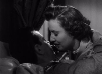 Movie still from “The File on Thelma Jordon” (1949), directed by Robert Siodmak – A man and a woman are kissing in a room; Close Up shot, Low angle