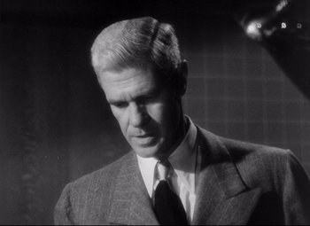 Movie still from “The File on Thelma Jordon” (1949), directed by Robert Siodmak – An older man wearing a suit and tie; Close Up shot, Low angle