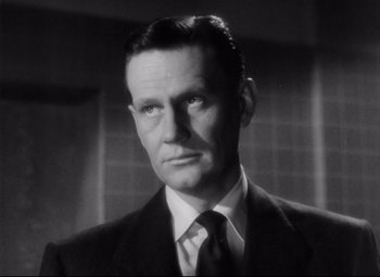 Movie still from “The File on Thelma Jordon” (1949), directed by Robert Siodmak – An older man in a suit and tie; Close Up shot, Low angle