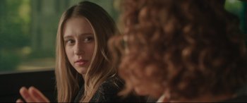 Movie still from “The Final Girls” (2015), directed by Todd Strauss-Schulson – A young woman looking at the reflection of herself in a mirror; Close Up shot, Over the shoulder angle